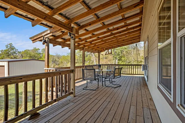 a view of roof deck with wooden floor