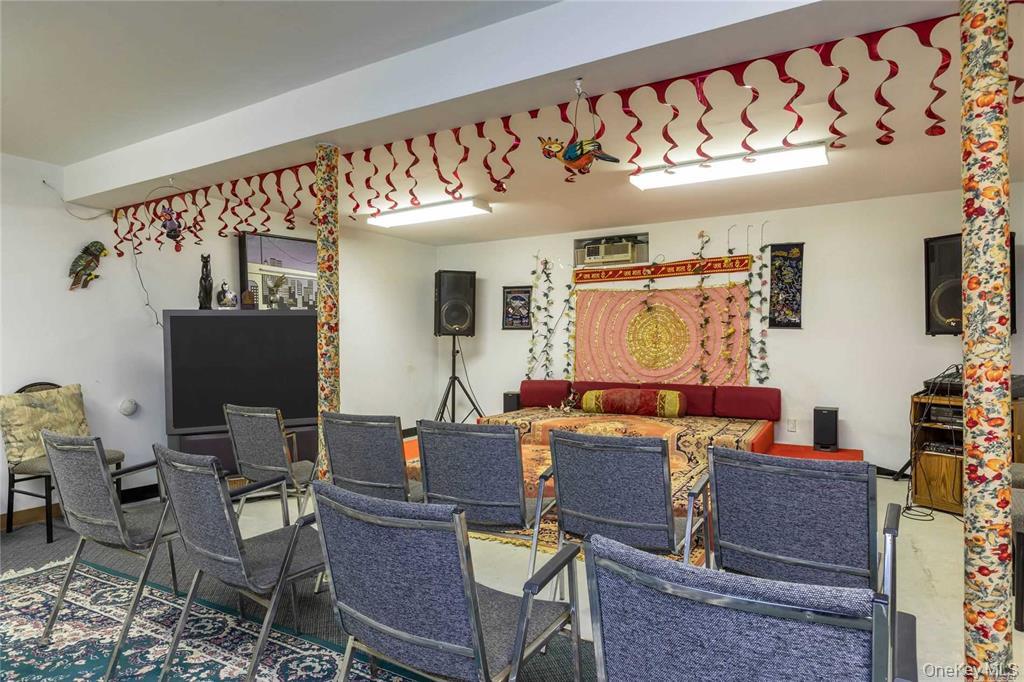 2-44 149th Street Queens, NY 11357 - Photo 18 of 20 a workspace with furniture and window