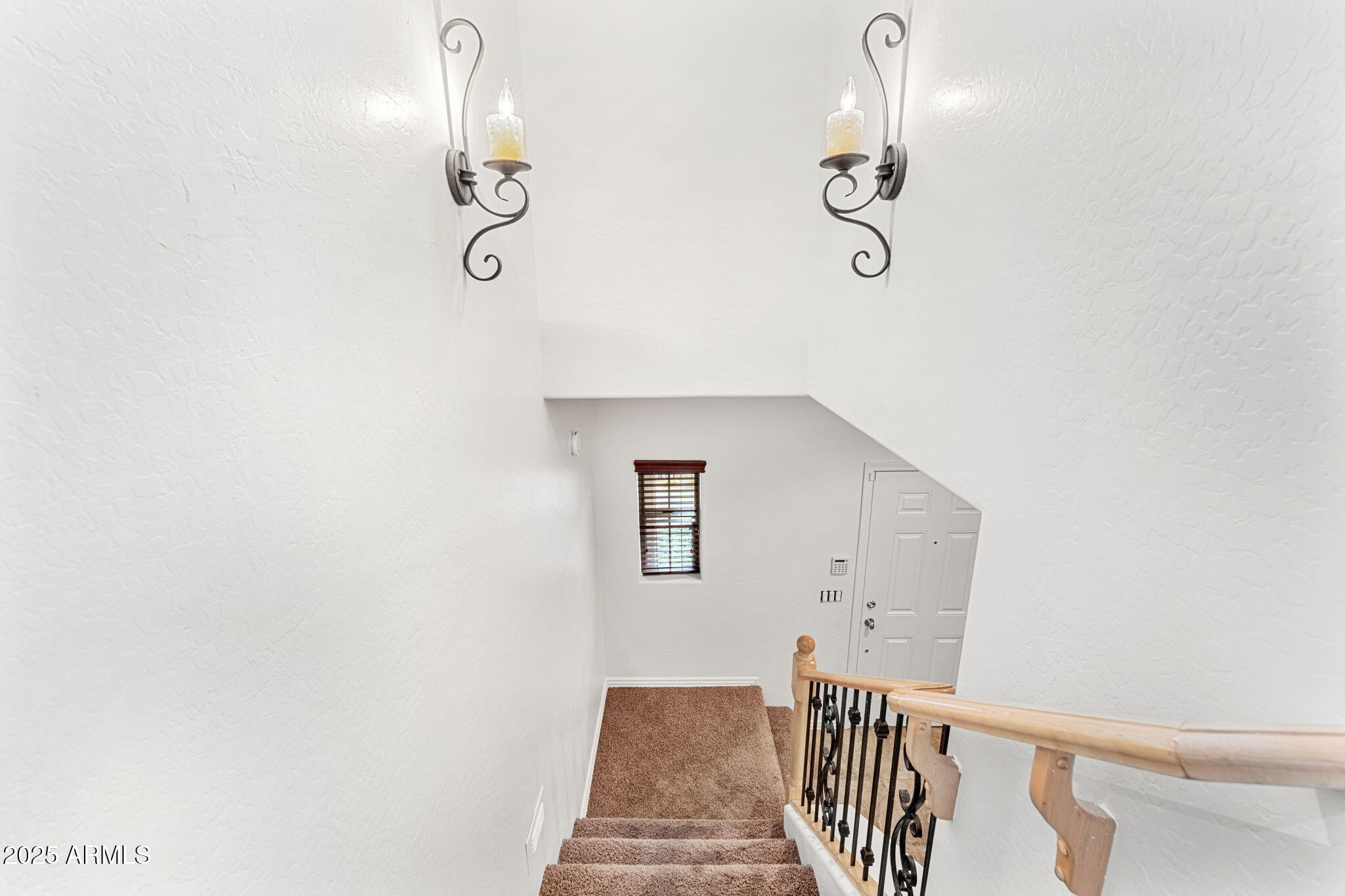 3935 East Rough Rider Road, Unit 1235 Phoenix, AZ 85050 - Photo 18 of 52 a view of a hallway with chandelier