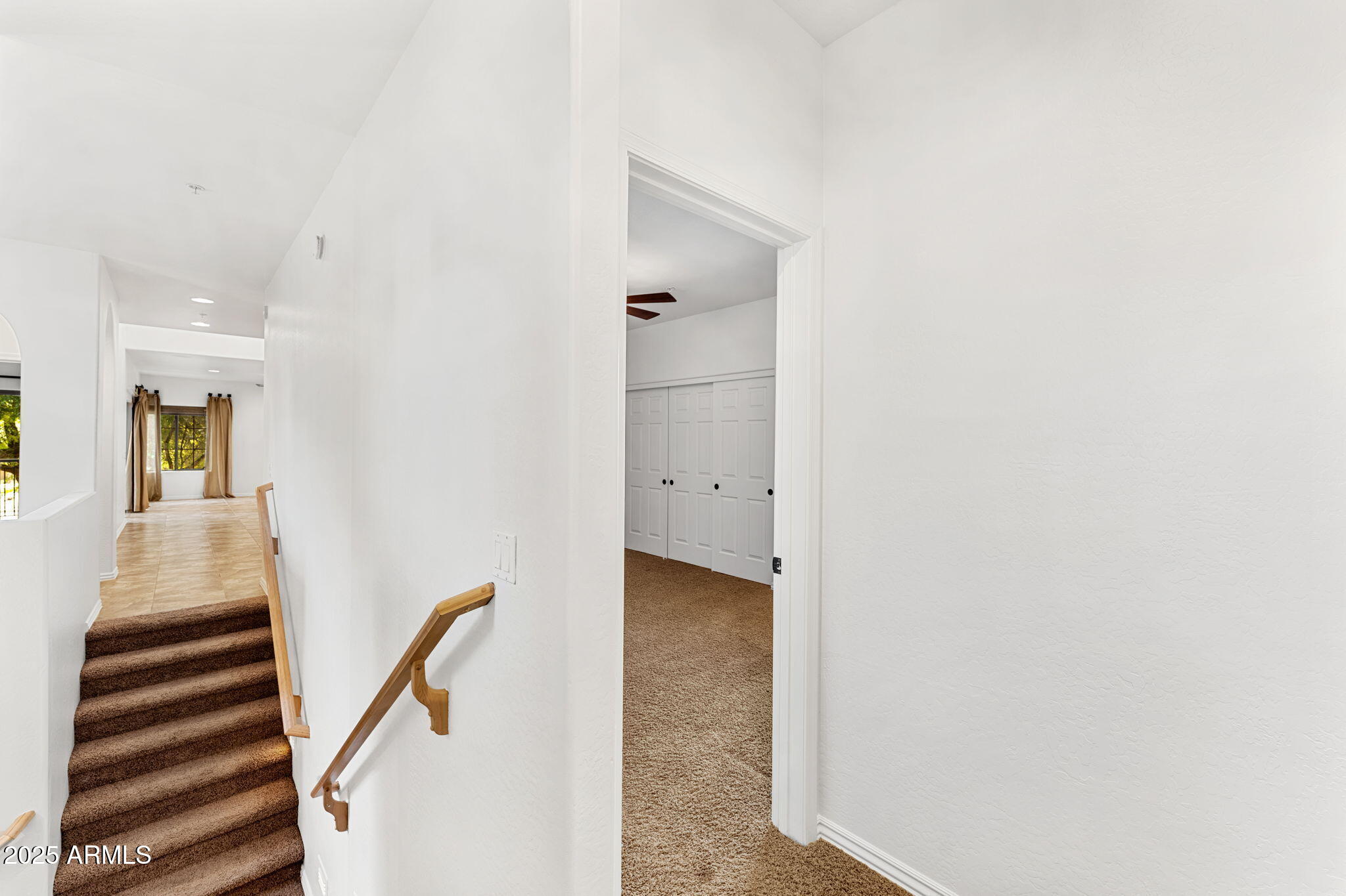 3935 East Rough Rider Road, Unit 1235 Phoenix, AZ 85050 - Photo 19 of 52 a view of a hallway with staircase