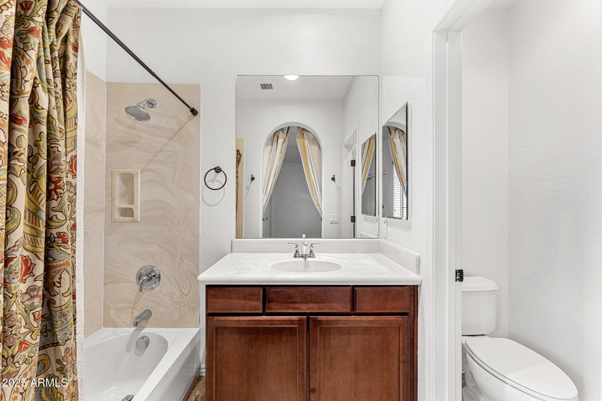 3935 East Rough Rider Road, Unit 1235 Phoenix, AZ 85050 - Photo 22 of 52 a bathroom with a sink a toilet and shower