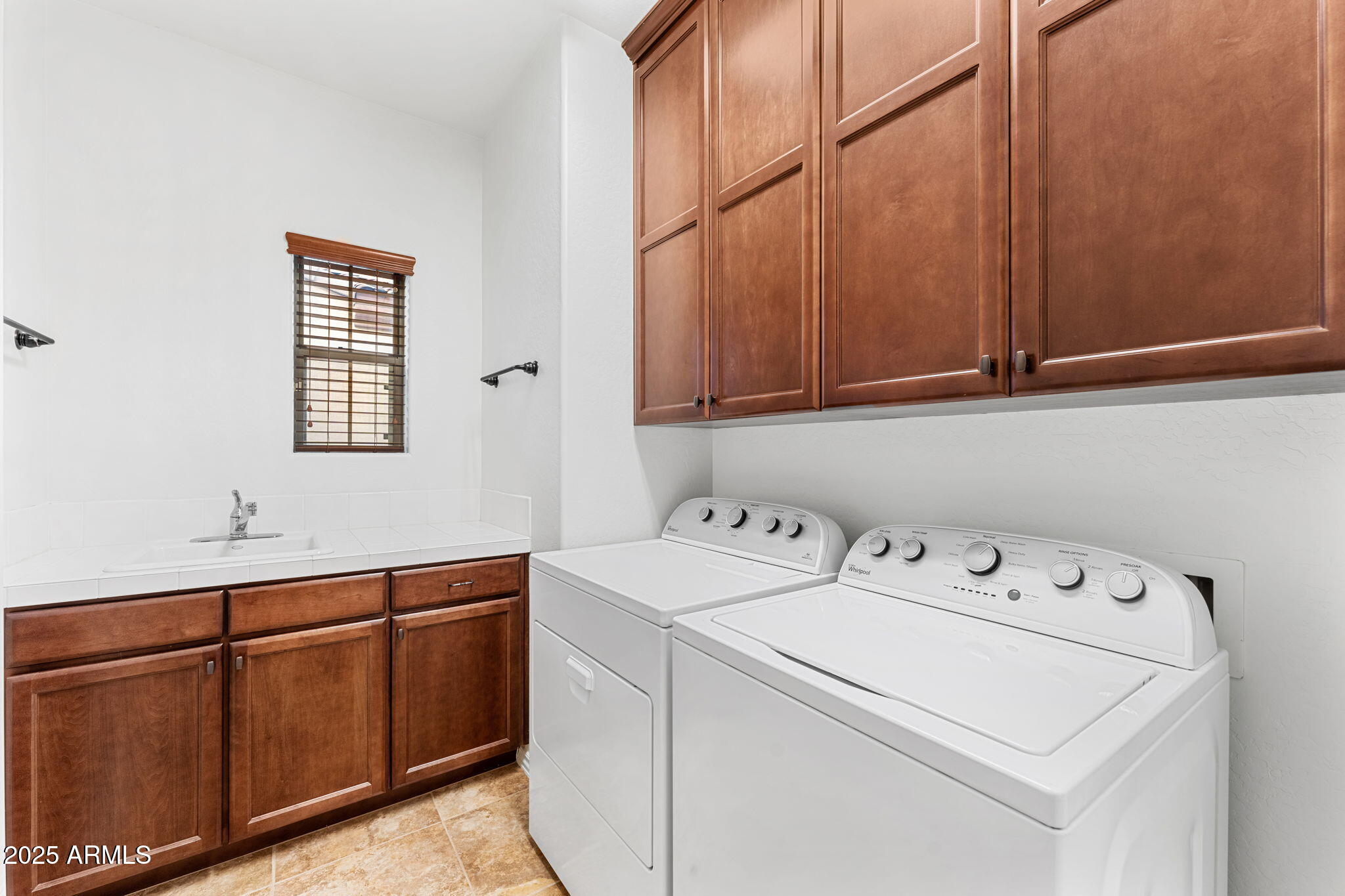 3935 East Rough Rider Road, Unit 1235 Phoenix, AZ 85050 - Photo 23 of 52 a utility room with dryer and washer