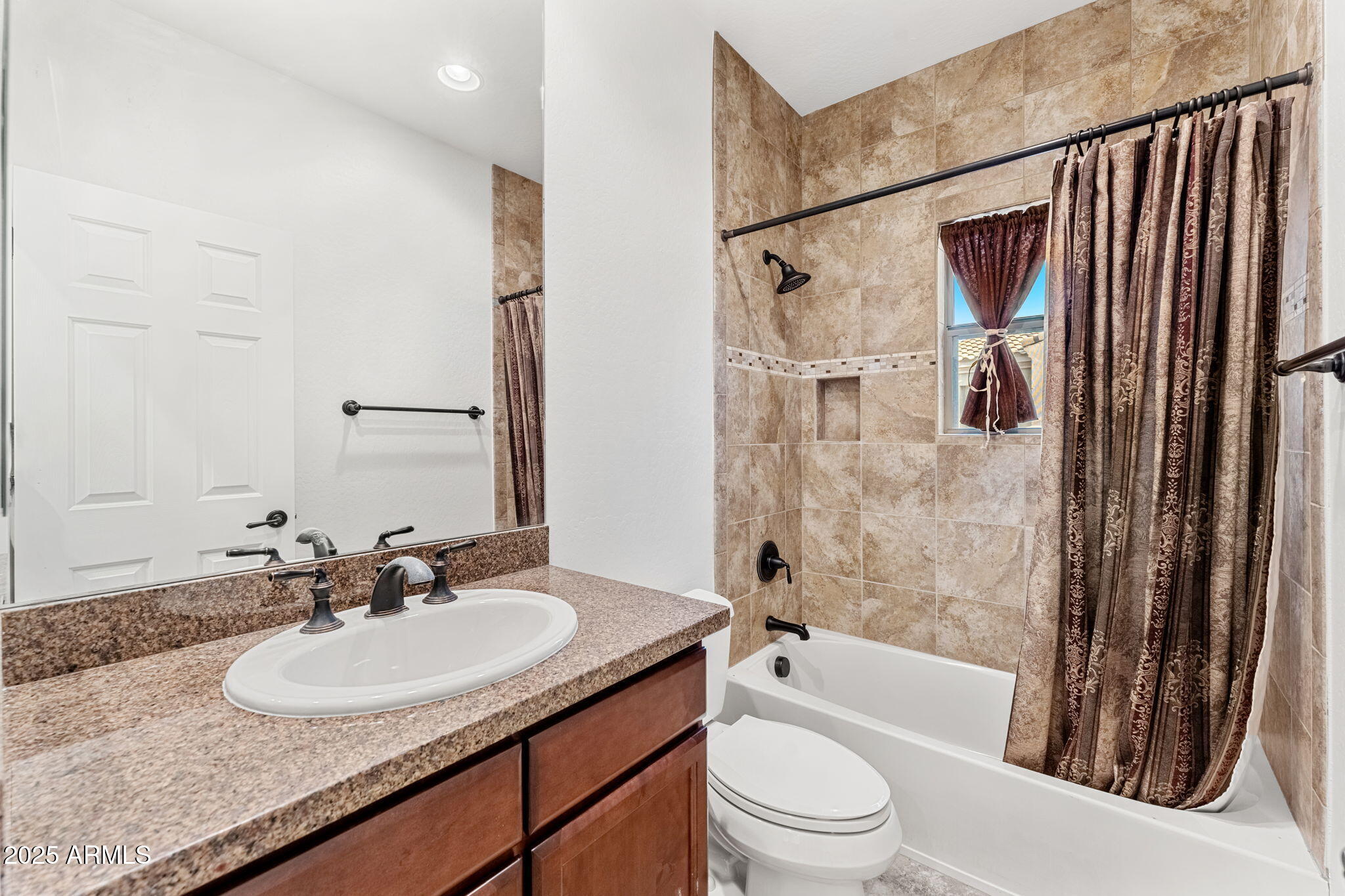 3935 East Rough Rider Road, Unit 1235 Phoenix, AZ 85050 - Photo 25 of 52 a bathroom with a granite countertop sink toilet and shower