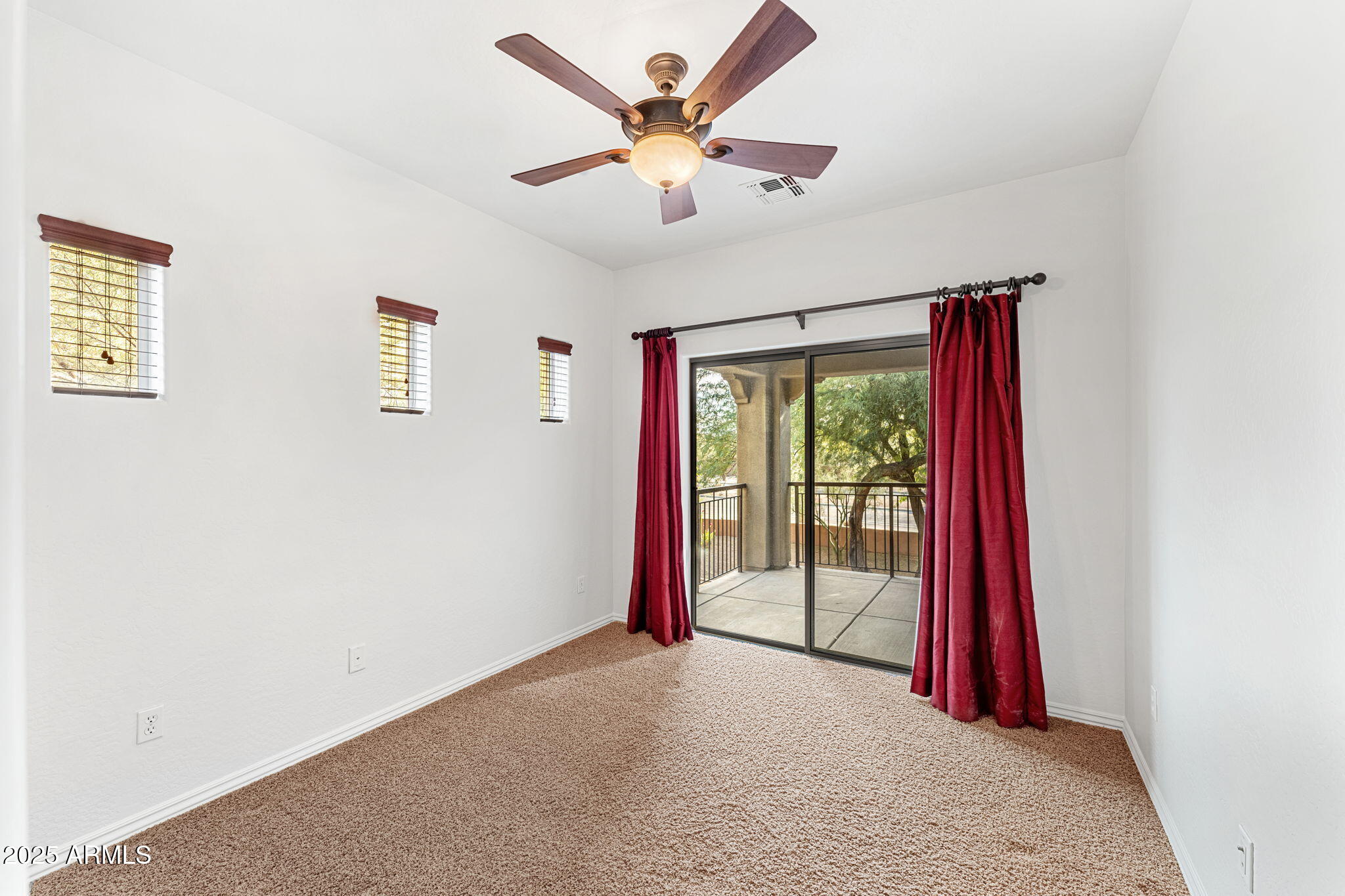 3935 East Rough Rider Road, Unit 1235 Phoenix, AZ 85050 - Photo 42 of 52 a view of a room with window and ceiling fan