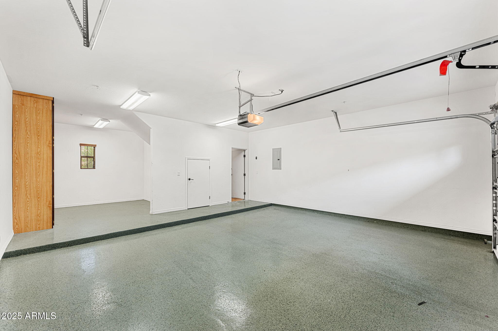 3935 East Rough Rider Road, Unit 1235 Phoenix, AZ 85050 - Photo 46 of 52 wooden floor in an empty room with a window