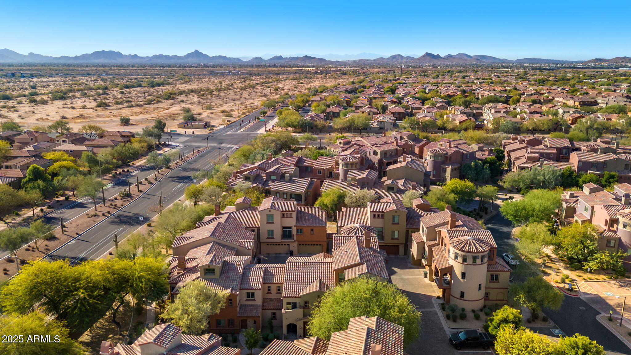 3935 East Rough Rider Road, Unit 1235 Phoenix, AZ 85050 - Photo 49 of 52 an aerial view of residential houses with outdoor space