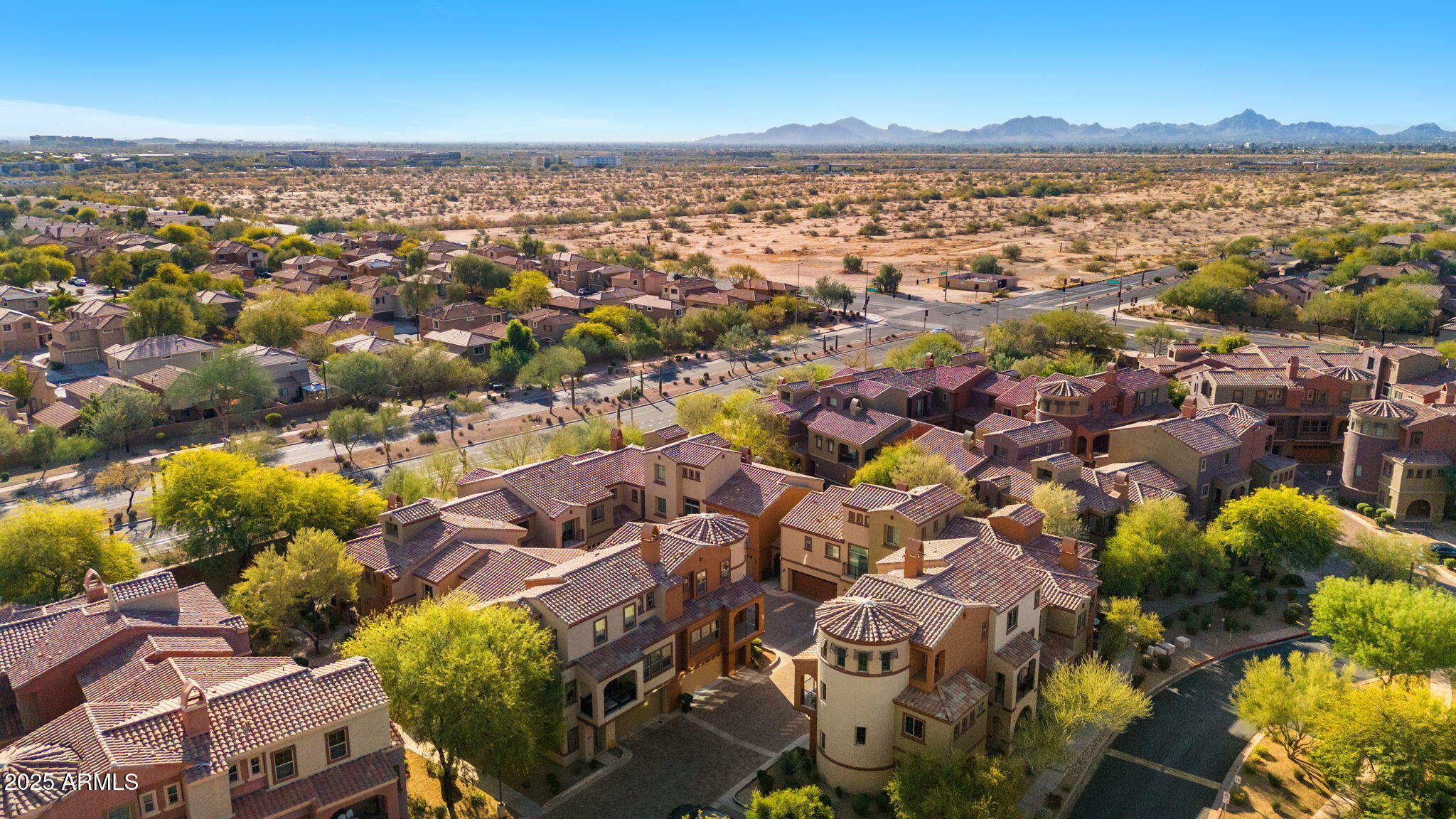 3935 East Rough Rider Road, Unit 1235 Phoenix, AZ 85050 - Photo 50 of 52 an aerial view of a city with lots of residential buildings