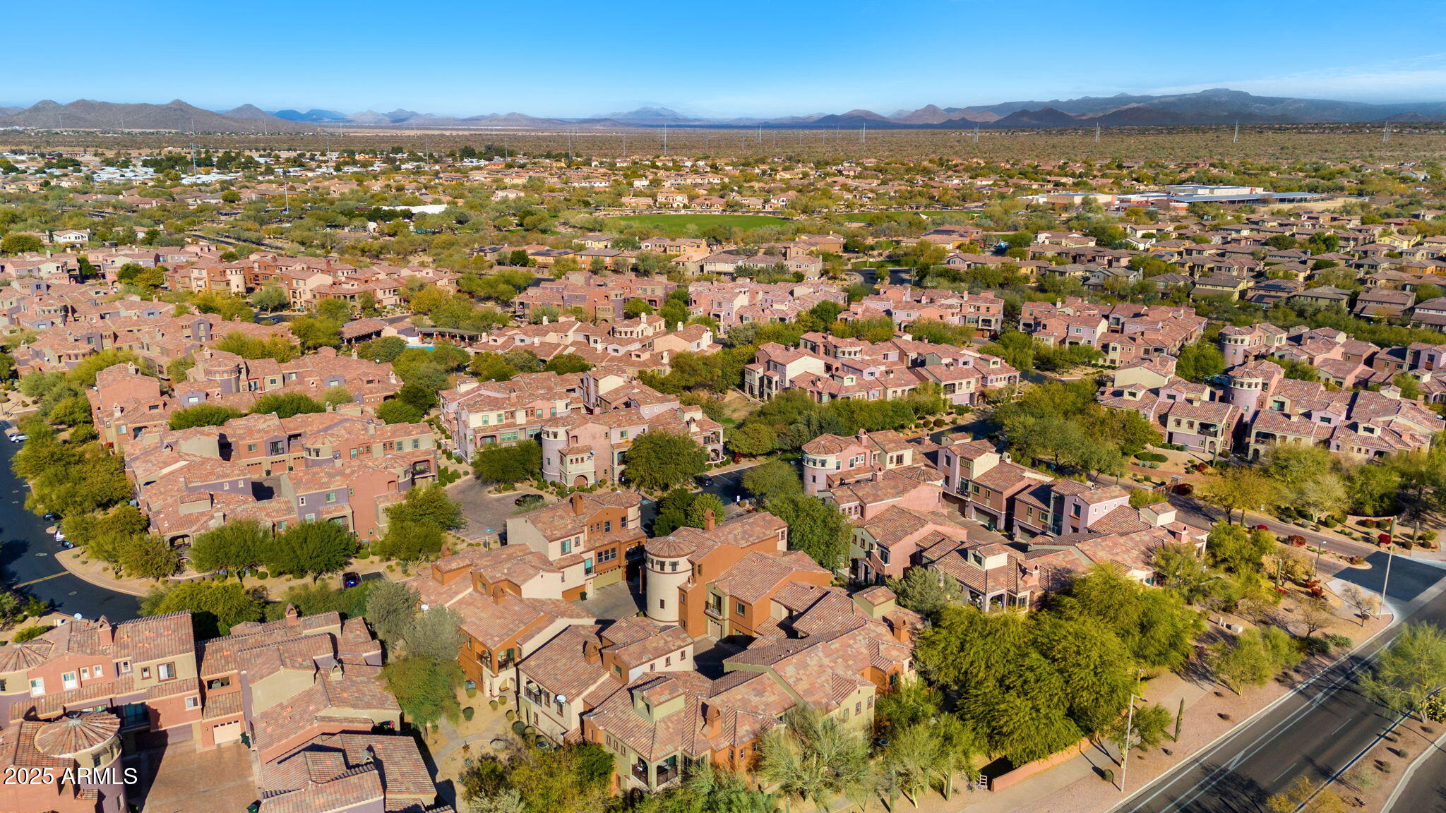 3935 East Rough Rider Road, Unit 1235 Phoenix, AZ 85050 - Photo 52 of 52 an aerial view of residential houses with outdoor space and trees