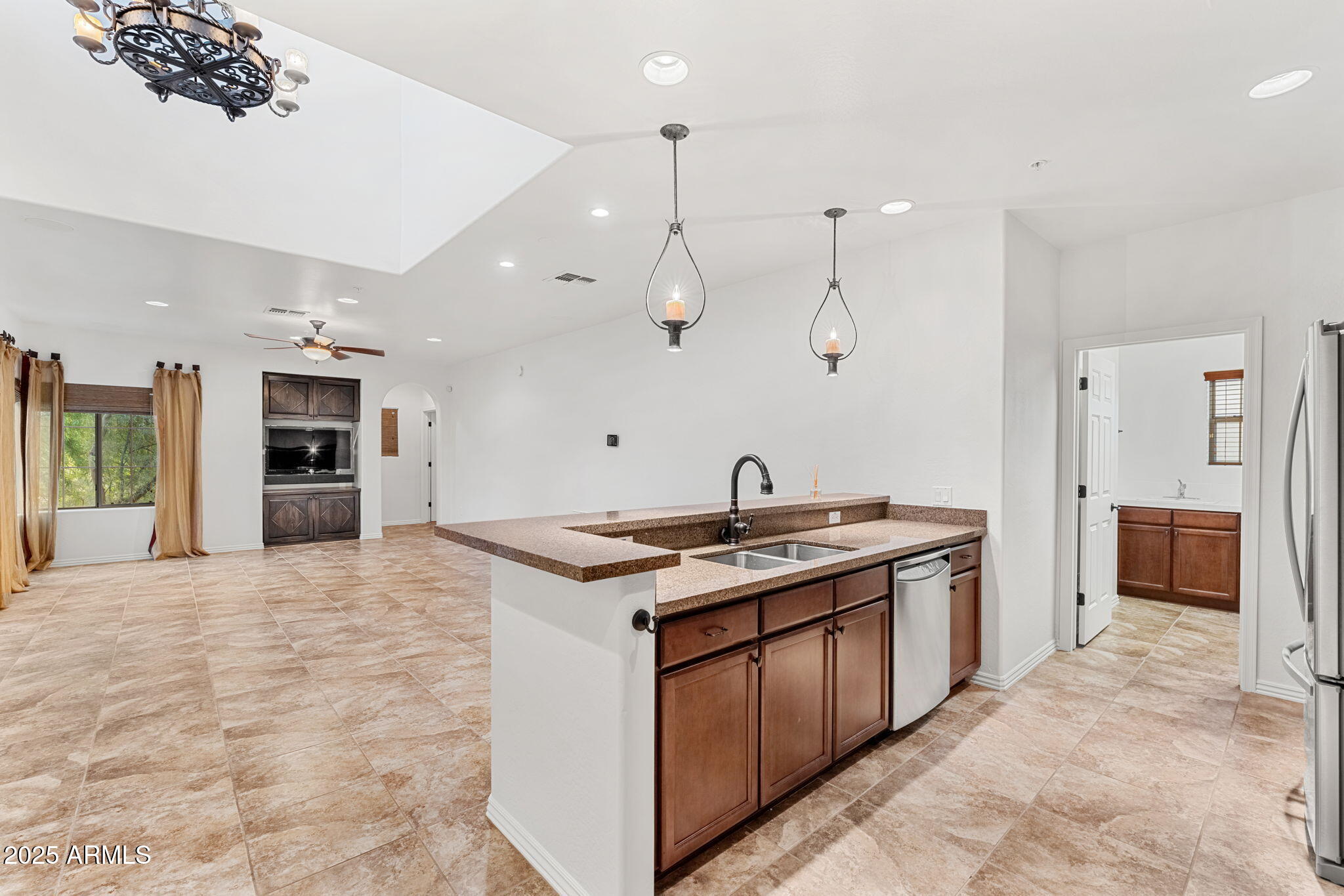 3935 East Rough Rider Road, Unit 1235 Phoenix, AZ 85050 - Photo 8 of 52 a kitchen with a stove and a sink
