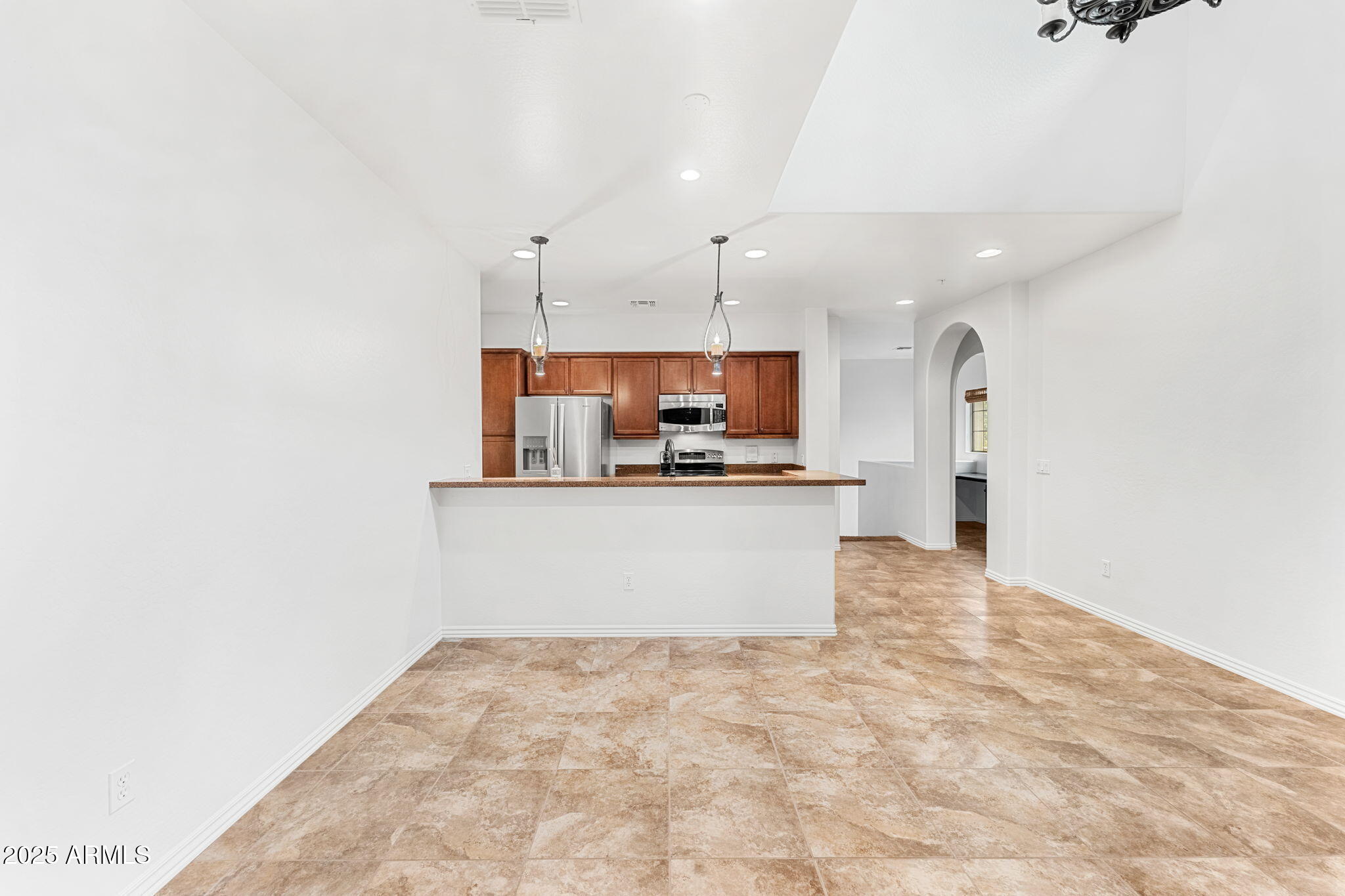 3935 East Rough Rider Road, Unit 1235 Phoenix, AZ 85050 - Photo 10 of 52 a view of kitchen with kitchen island microwave and refrigerator