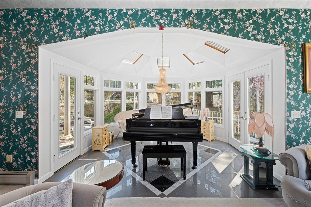 175 Pleasant Street Upton, MA 01568 - Photo 14 of 41 a view of a patio with couches table and chairs and potted plants
