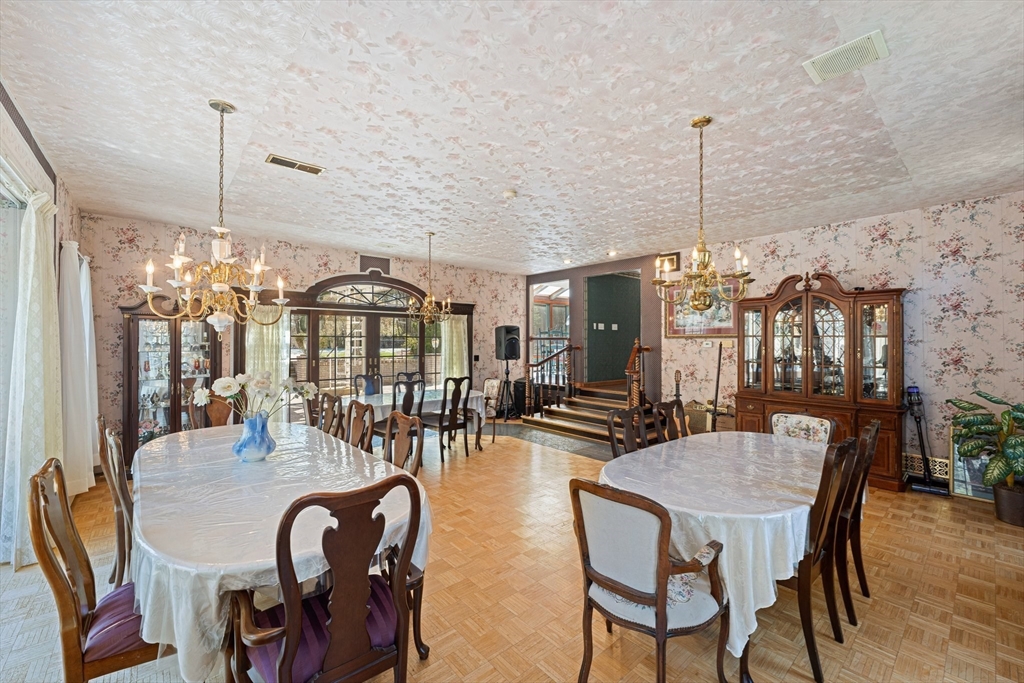 175 Pleasant Street Upton, MA 01568 - Photo 18 of 41 a view of a dining room with furniture and chandelier