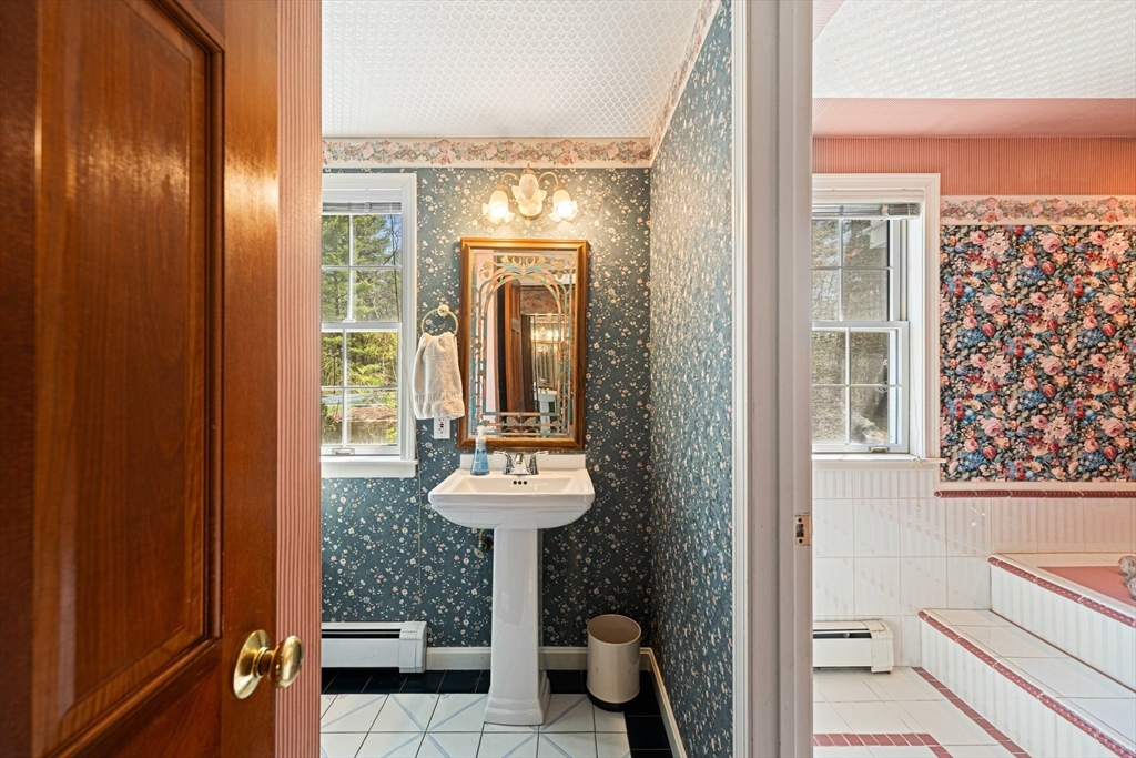 175 Pleasant Street Upton, MA 01568 - Photo 19 of 41 a bathroom with a sink a toilet and shower