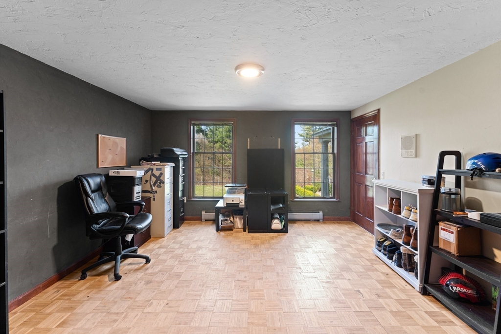 175 Pleasant Street Upton, MA 01568 - Photo 20 of 41 a view of a livingroom with workspace and a window