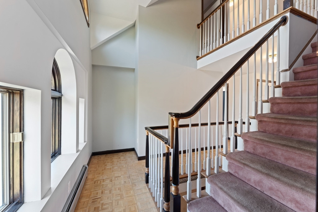175 Pleasant Street Upton, MA 01568 - Photo 24 of 41 a view of staircase with wooden floor and white walls