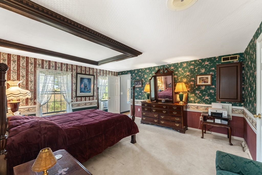 175 Pleasant Street Upton, MA 01568 - Photo 25 of 41 a bedroom with a bed and large windows