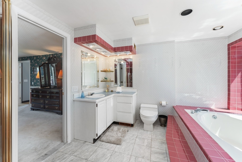 175 Pleasant Street Upton, MA 01568 - Photo 26 of 41 a bathroom with a double vanity sink mirror and toilet