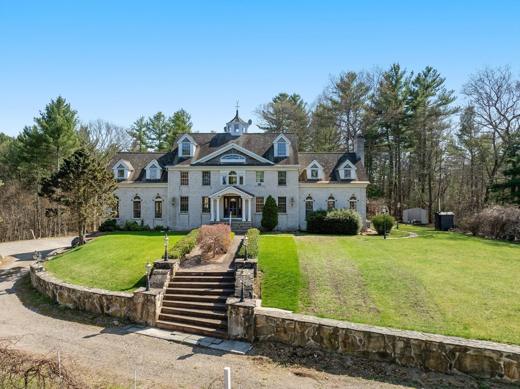 175 Pleasant Street Upton, MA 01568 - Photo 3 of 41 a front view of a house with garden