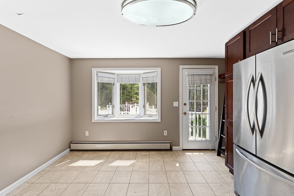 175 Pleasant Street Upton, MA 01568 - Photo 32 of 41 a view of an empty room with a window