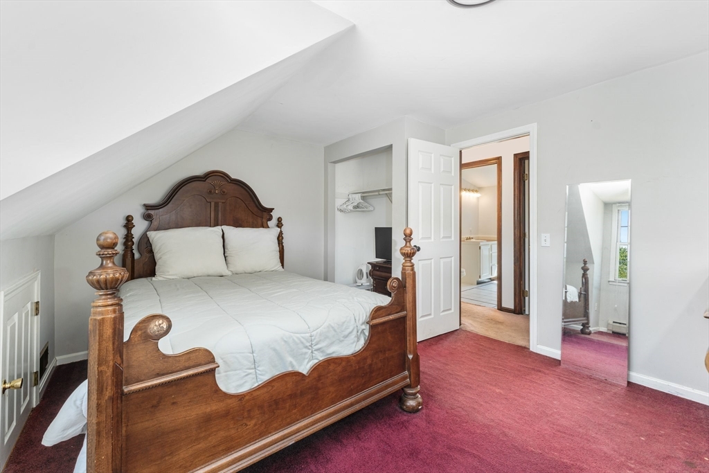 175 Pleasant Street Upton, MA 01568 - Photo 34 of 41 a bed sitting in a bedroom and table