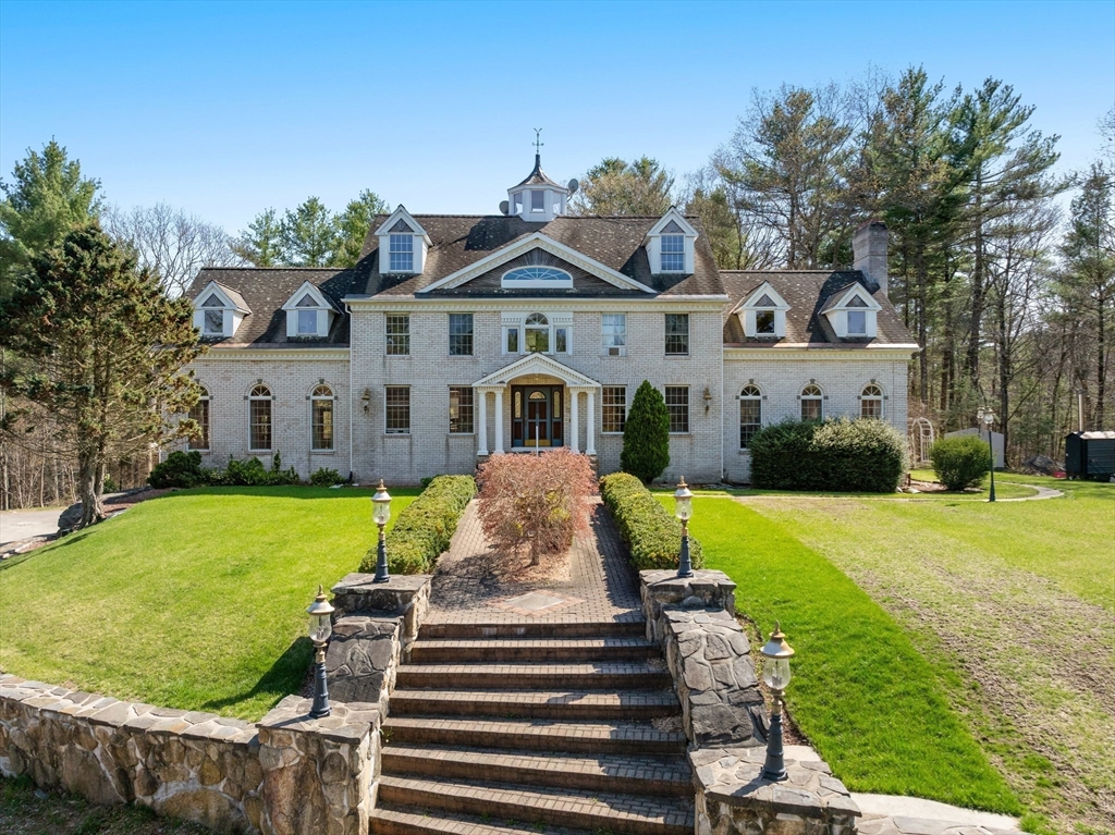 175 Pleasant Street Upton, MA 01568 - Photo 40 of 41 a front view of a house with garden