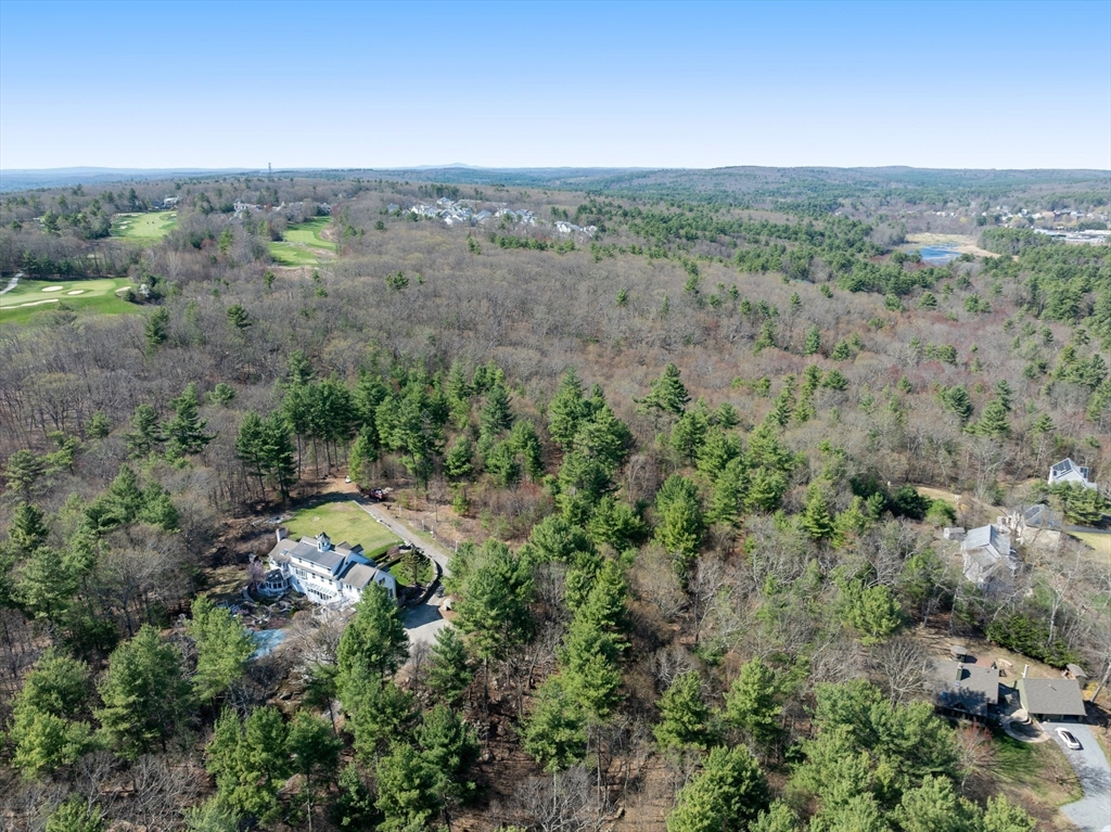 175 Pleasant Street Upton, MA 01568 - Photo 5 of 41 an aerial view of green landscape with trees houses and mountain view