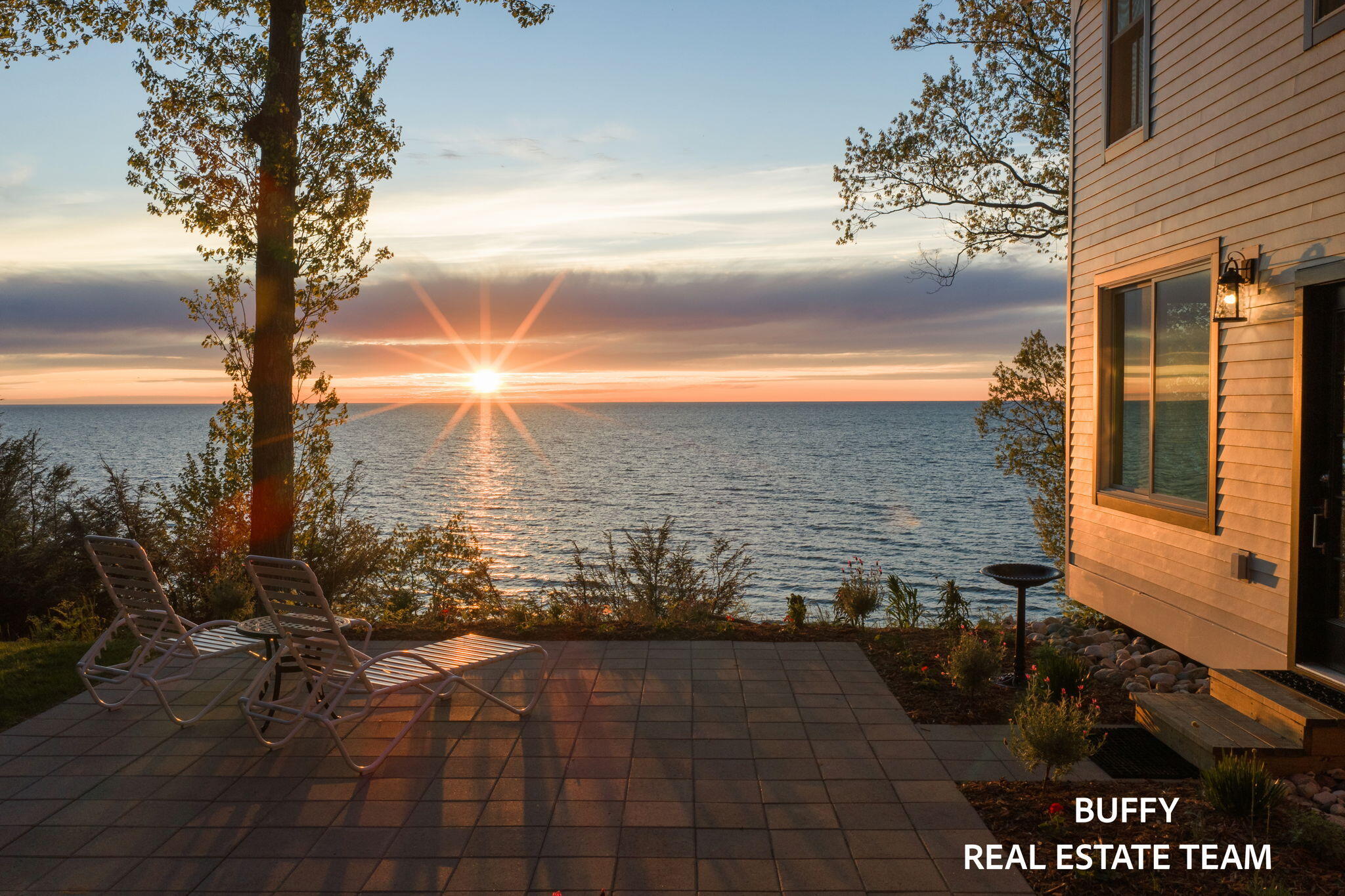 8282 West Harrison Road Mears, MI 49436 - Photo 12 of 146 Main House Side Patio Sunset View