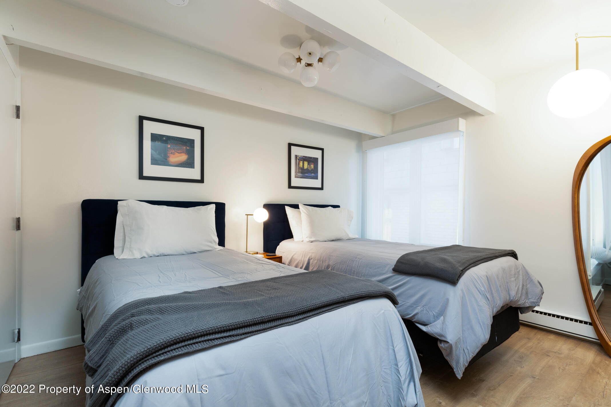 731 East Durant Avenue, Unit 6 Aspen, CO 81611 - Photo 9 of 14 a bedroom with a bed and a couch