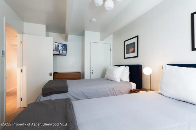 a bedroom with a bed and a lamp