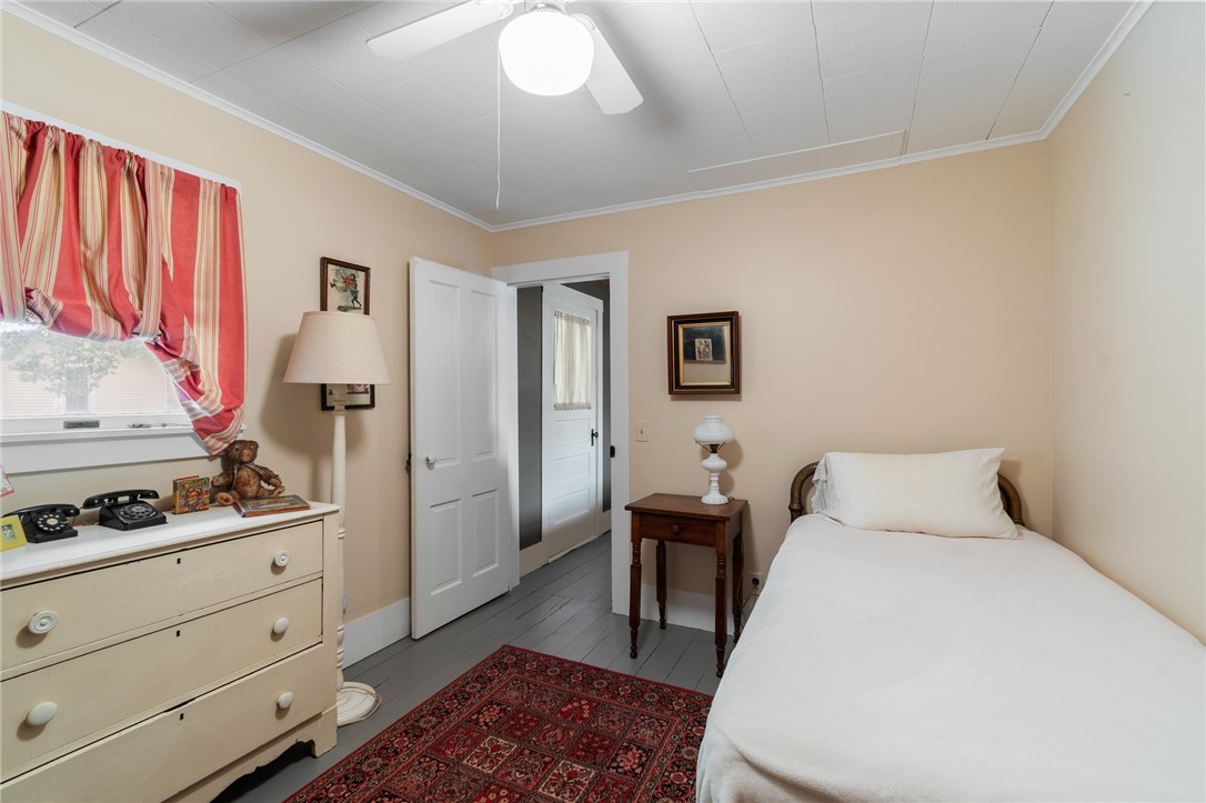 4007 Ridge Road Williamson, NY 14589 - Photo 29 of 34 One of the upstairs bedrooms - real wood PLANK flooring!