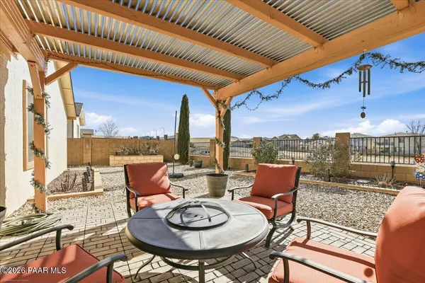 a outdoor space with patio couch and a potted plant