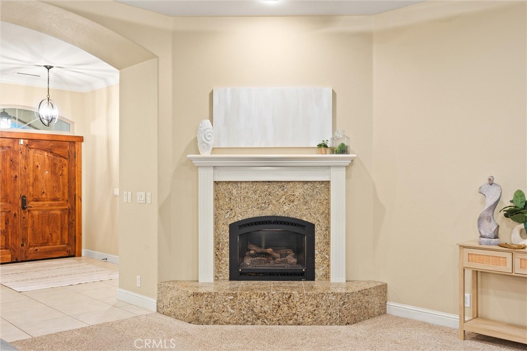 10473 Bogie Way Chico, CA 95928 - Photo 17 of 46 a living room with a fireplace and a rug