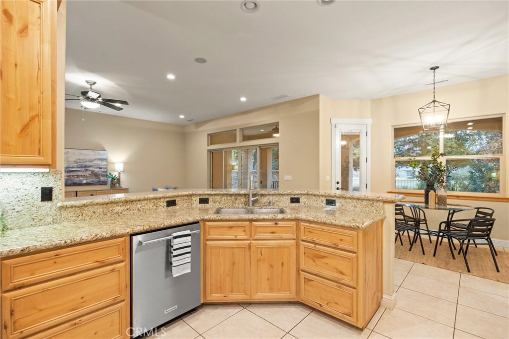 10473 Bogie Way Chico, CA 95928 - Photo 24 of 46 a kitchen with a sink stove and cabinets