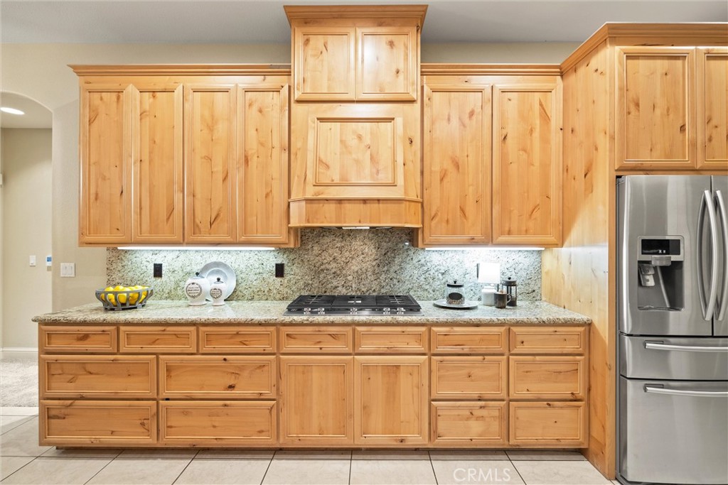 10473 Bogie Way Chico, CA 95928 - Photo 28 of 46 a kitchen with granite countertop cabinets and stainless steel appliances
