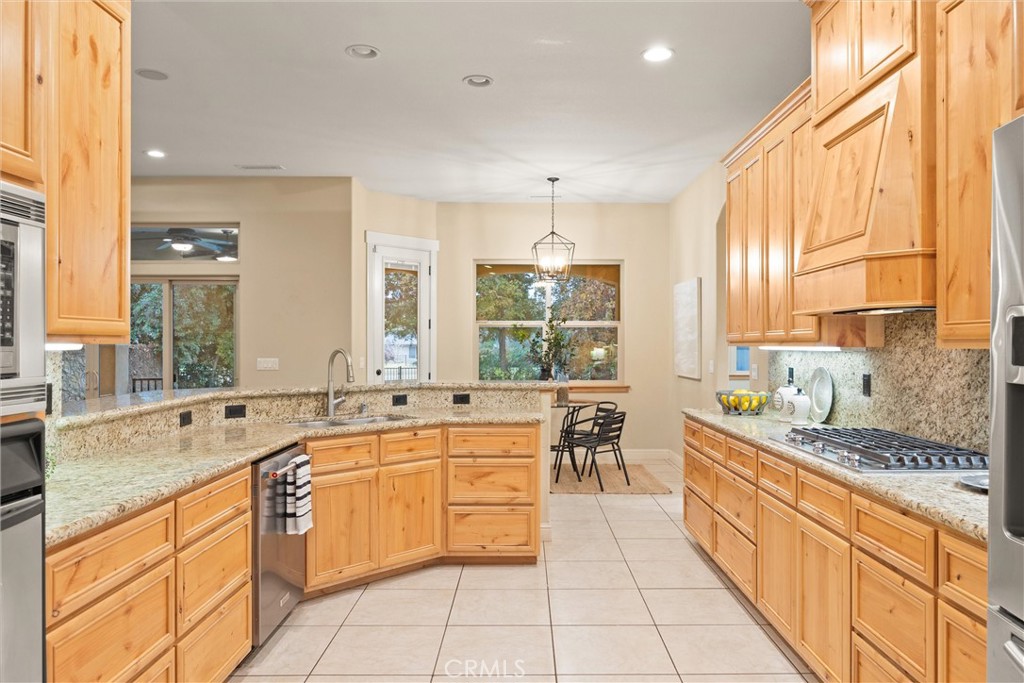 10473 Bogie Way Chico, CA 95928 - Photo 29 of 46 a large white kitchen with a large window