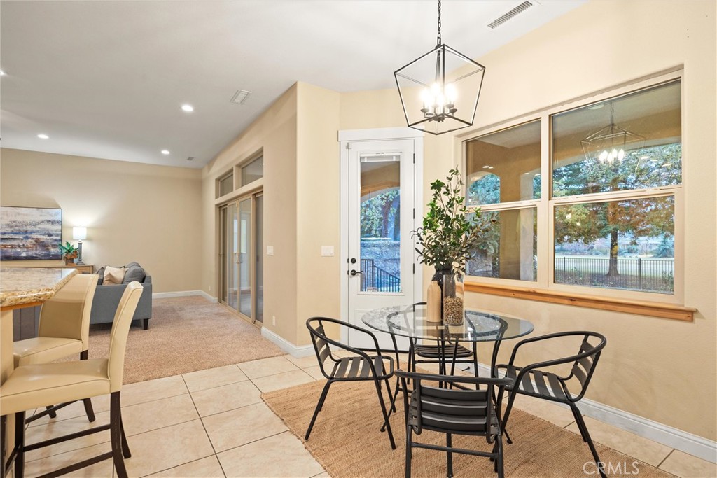 10473 Bogie Way Chico, CA 95928 - Photo 30 of 46 a dining room with furniture and window