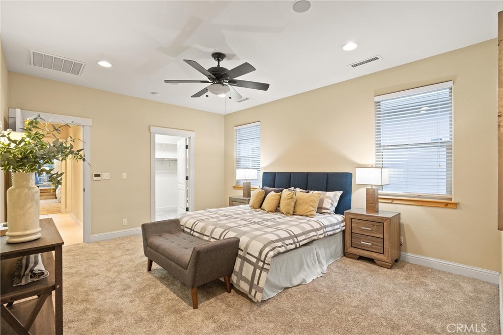 10473 Bogie Way Chico, CA 95928 - Photo 31 of 46 a bedroom with a bed chandelier and a window