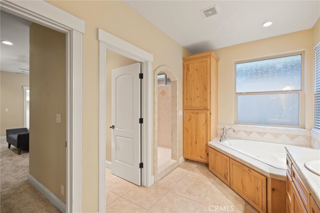 10473 Bogie Way Chico, CA 95928 - Photo 33 of 46 a spacious bathroom with a tub shower and sink