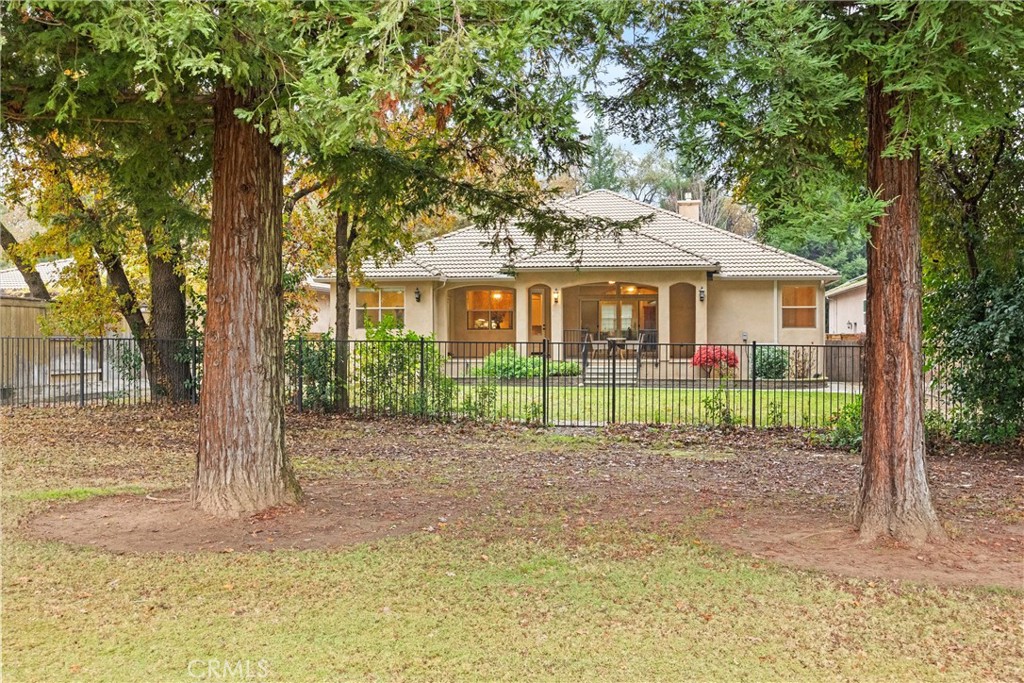 10473 Bogie Way Chico, CA 95928 - Photo 46 of 46 a view of a house with a yard in a forest