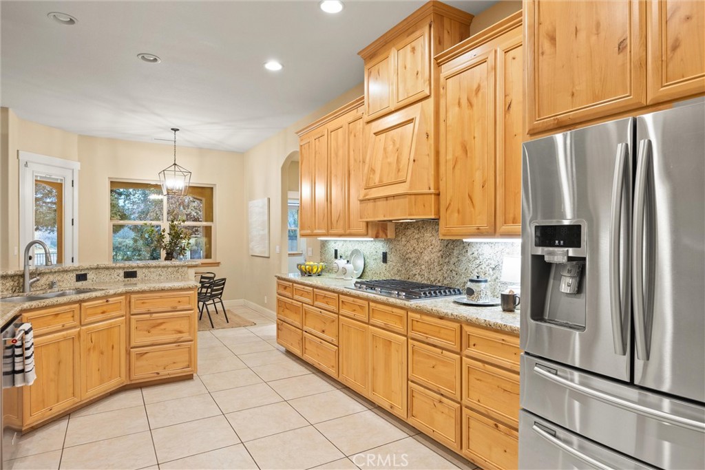 10473 Bogie Way Chico, CA 95928 - Photo 6 of 46 a kitchen with stainless steel appliances a sink counter space and a window