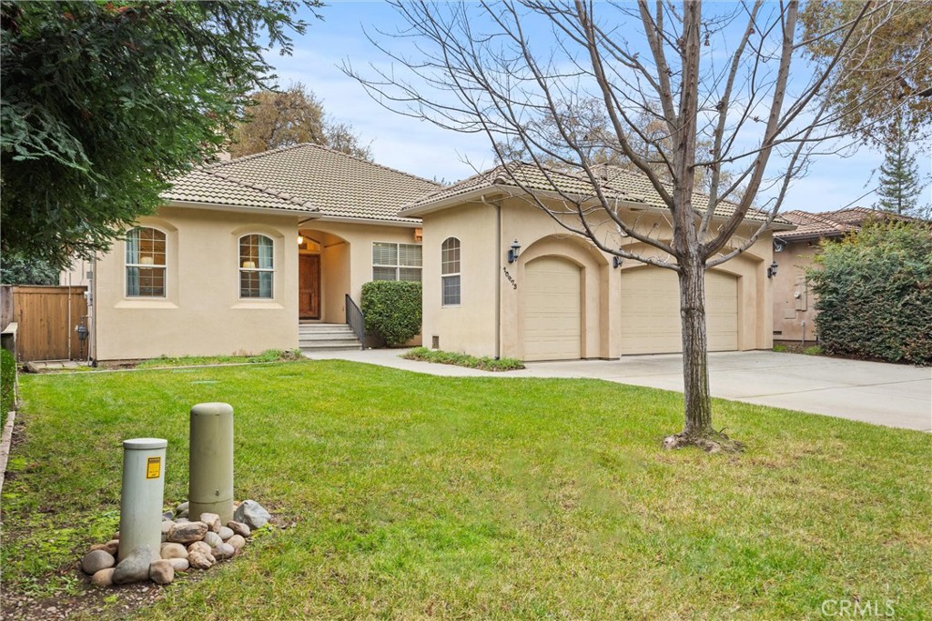 10473 Bogie Way Chico, CA 95928 - Photo 10 of 46 a front view of a house with yard