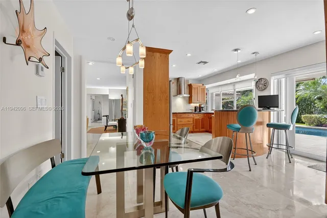a living room with furniture ceiling fan and a rug