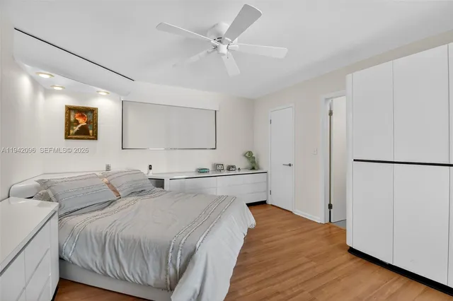 a bathroom with a glass shower door and a sink