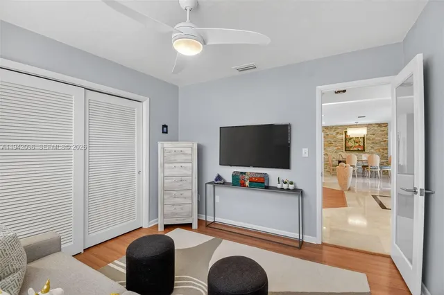 a bathroom with a granite countertop sink a toilet and bathtub