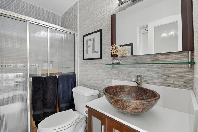 a view of a house with swimming pool and sitting area