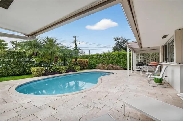 an aerial view of residential houses with city view