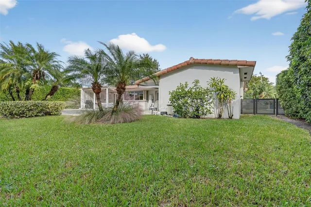 an aerial view of a house with a lake view