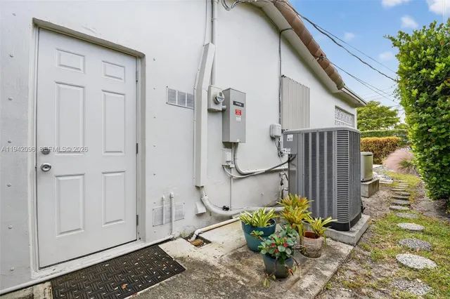 an aerial view of residential houses with city view