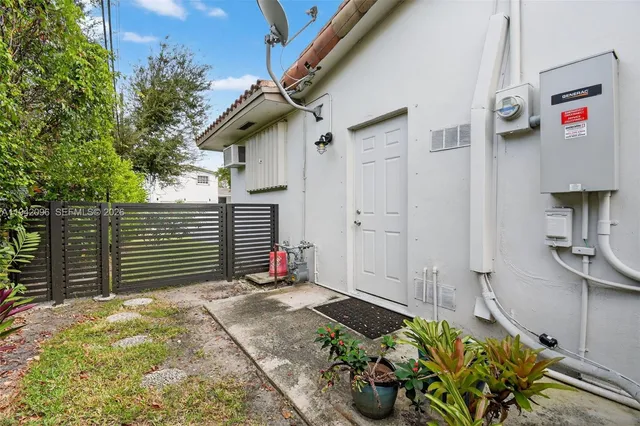 an aerial view of a house with a garden