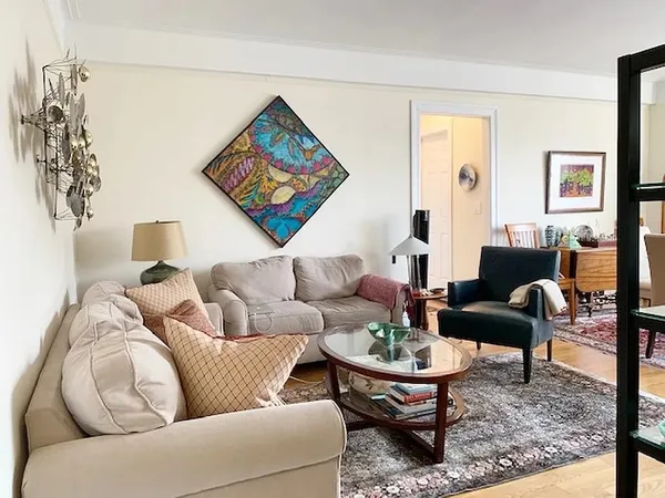 a living room with furniture and a rug